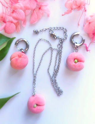 Handmade polymer clay peach jewelry set showing matching huggie earrings and necklace pendant – by Julia Spiri