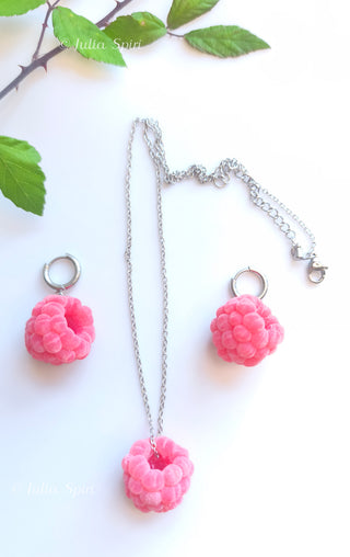 Flat lay of handmade polymer clay raspberry earrings and necklace set with silver chain, by Julia Spiri