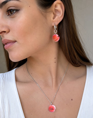 Handmade polymer clay peach jewelry set by Julia Spiri — matching huggie earrings and pendant necklace, stainless steel in model