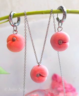 Handmade polymer clay peach jewelry set by Julia Spiri — matching huggie earrings and pendant necklace, stainless steel
